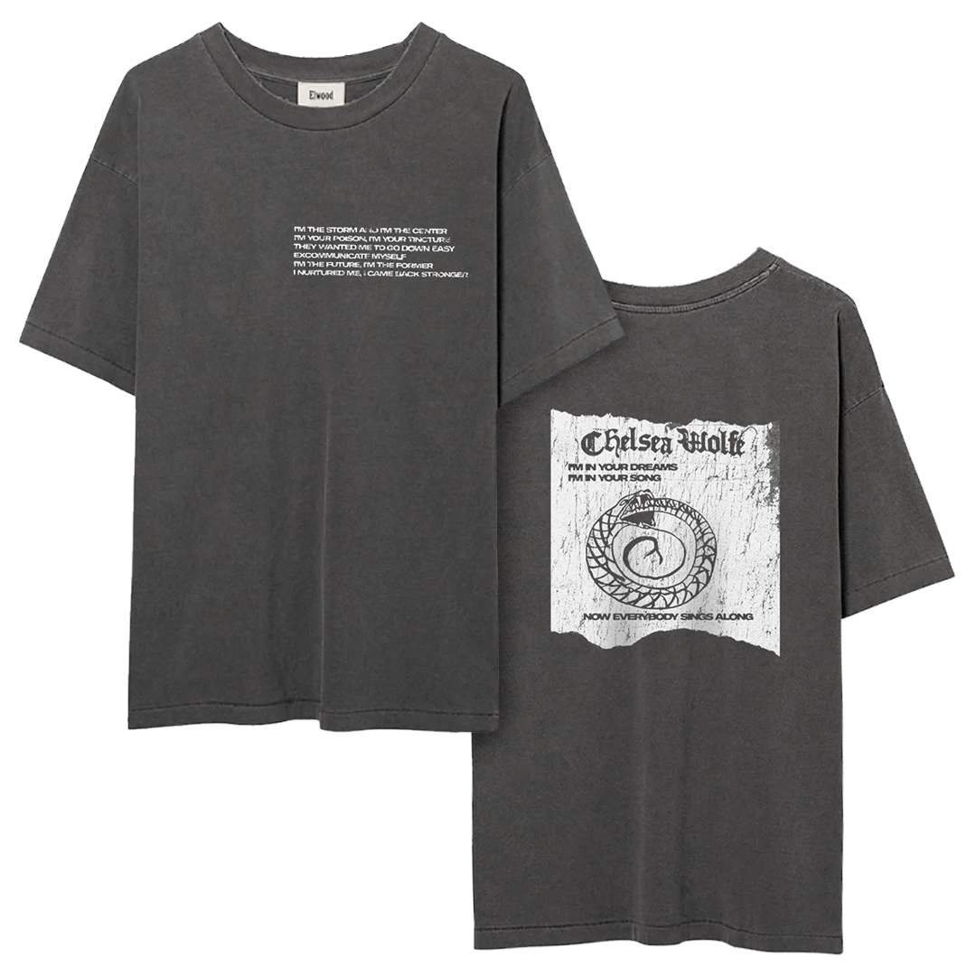 Two dark gray oversized graphic t-shirts shown on a white background, one displaying the front with white text and the other showing the back with a distressed Chelsea Wolfe band merch print.