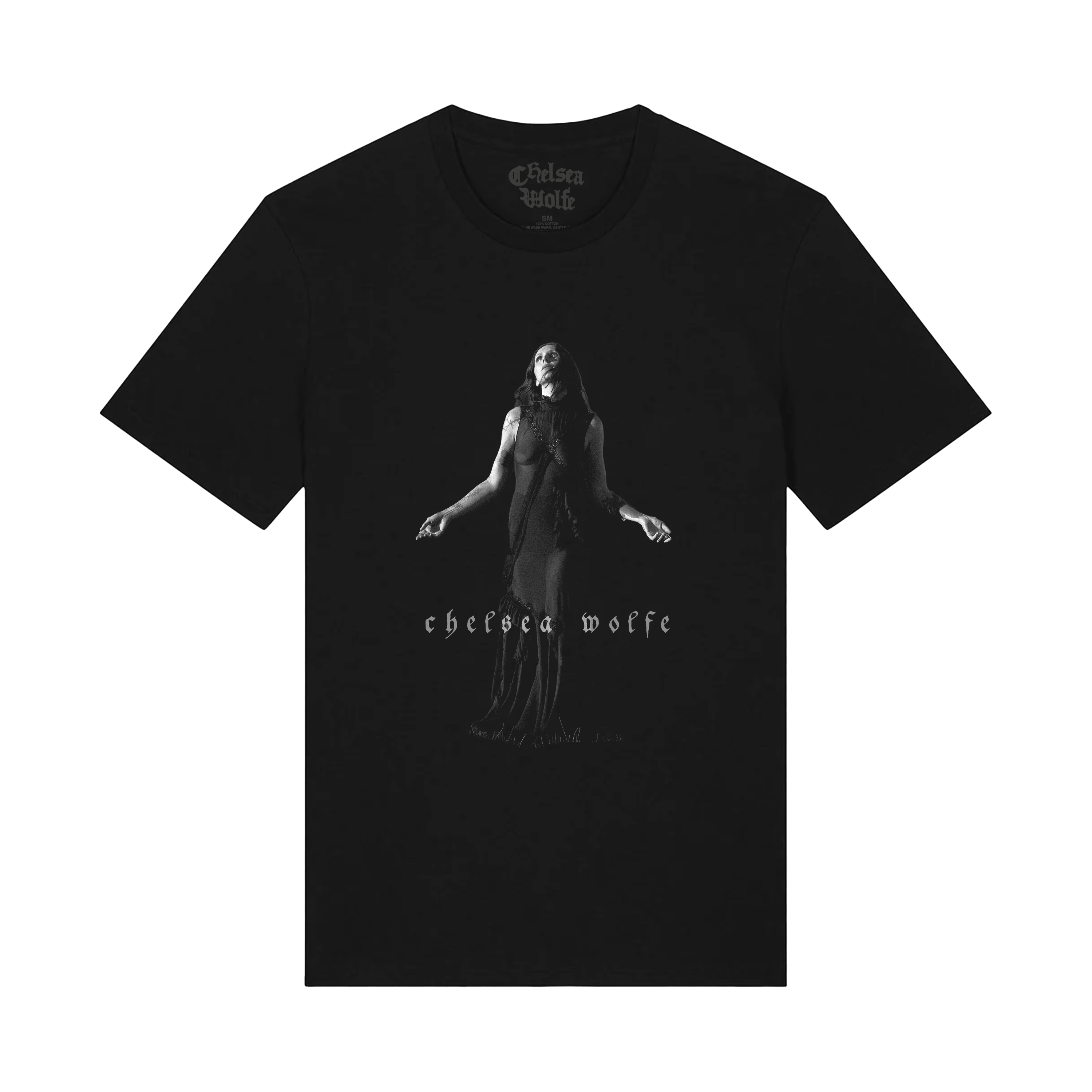 A black short-sleeve crewneck t-shirt featuring a grayscale graphic of a woman in a long dress with outstretched arms, and the text 'chelsea wolf' printed below. The Chelsea Wolf brand logo is visible inside the collar.