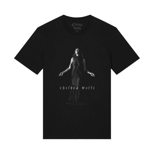 A black short-sleeve crewneck t-shirt featuring a grayscale graphic of a woman in a long dress with outstretched arms, and the text 'chelsea wolf' printed below. The Chelsea Wolf brand logo is visible inside the collar.